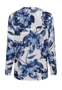 Langärmlige Bluse aus leichtem Stoff mit einem blauen Blumenmuster auf weißem Hintergrund, rundem Ausschnitt und Knopfmanschetten.