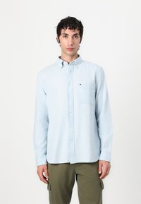 Tommy Hilfiger POCKET SHIRT UNISEX - Button-down blouse - light blue chambray