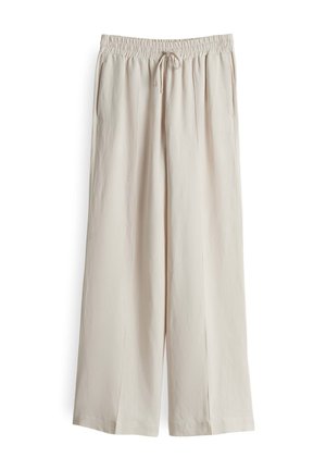 Pantalons larges beige clair avec une taille élastique et un cordon de serrage, comportant deux poches latérales et un tissu lisse et texturé.
