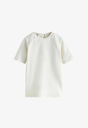 T-shirt blanc à manches courtes en tissu lisse ; doté d'un col rond et de manches raglan avec des coutures nettes.