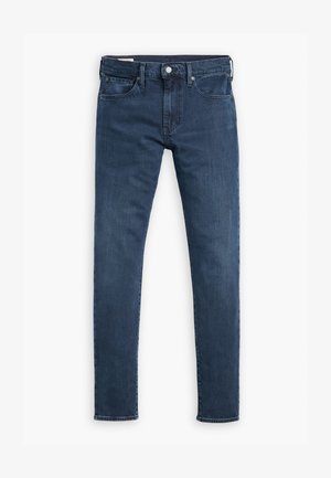 Tamsiai mėlynos džinsinės kelnes, pasižyminčios siauru siluetu, penkių kišenių dizainu ir užtrauktuku su mygtuko uždarymu. Lygi tekstūra, minimaliai išblukusi.