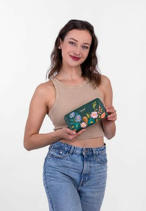 Green leather wallet with floral embroidery in blue, pink, and orange. Rectangular shape with a zipper closure. Smooth texture.