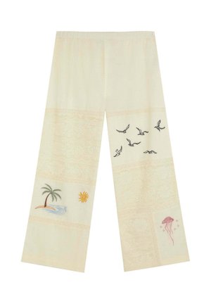 Pantalones anchos en color crema con bordados de palmera, sol, pájaros volando y medusas rosas en la parte inferior de las piernas.