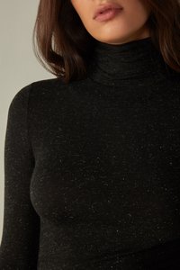 Black turtleneck top with a fitted design, textured fabric featuring subtle sparkles, high collar, and long sleeves. No visible patterns.
