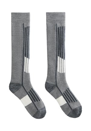 Szürke, térd fölé érő zoknik, textúrázott mintával, fehér és sötétszürke csíkokkal. Puha, tartós anyagból készültek.