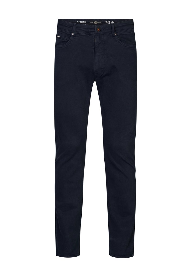 Jeans azul oscuro en corte slim, hechos de denim con una textura suave. Cuenta con cinco bolsillos y un botón de cremallera metálico.