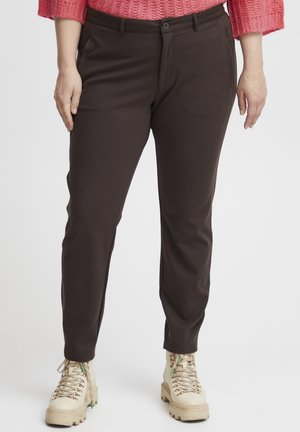 Ruiskeat Slim-fit-housut, jotka on valmistettu joustavasta kankaasta, varustettu nappisulkimella ja taskuilla. Yhdistetty beigellä nauhakengillä.