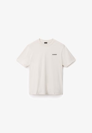 Krótki rękaw, kremowa koszulka wykonana z bawełny. Na lewej piersi znajduje się małe czarne logo, a koszulka ma klasyczny okrągły dekolt.