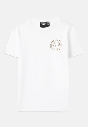 White cotton t-shirt featuring a round neckline and short sleeves. A gold circular logo is printed on the chest. Smooth texture.