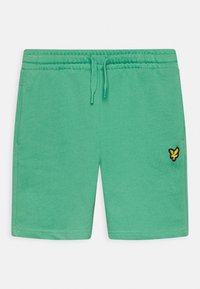 Green casual shorts with elastic waistband, drawstring, side pockets, and a small yellow bird logo on the right leg.