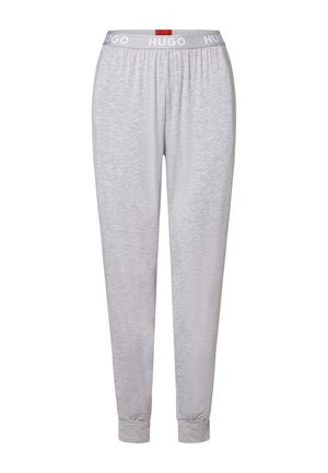Lichtgrijze joggerbroek met elastische boorden en een witte tailleband met het "HUGO"-logo in vetgedrukte letters.