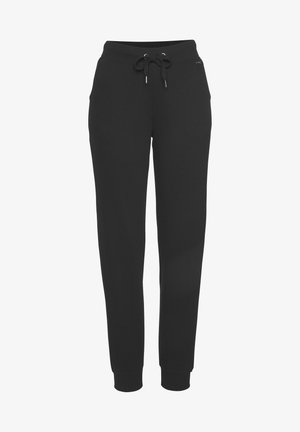 Zwarte joggingbroek van zacht materiaal, met een elastische tailleband met een trekkoord, twee zijzakken en aansluitende manchetten bij de enkels.