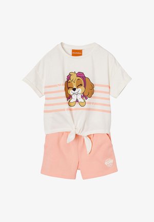 White short-sleeve top with pink stripes and cartoon dog wearing goggles, paired with light pink shorts featuring a small Paw Patrol logo.