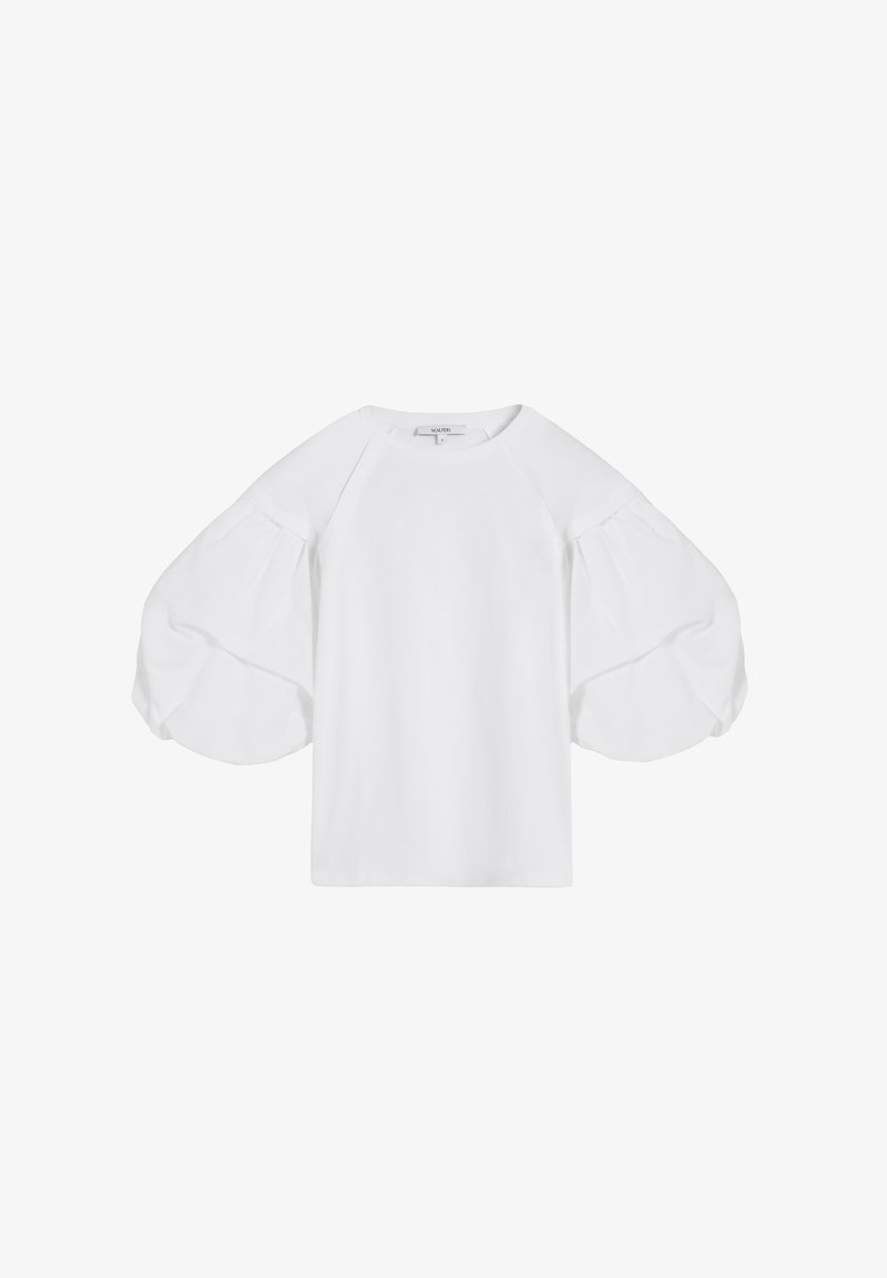 Blusa bianca con scollatura rotonda e maniche voluminose a palloncino che arrivano fino ai gomiti, realizzata in tessuto leggero.