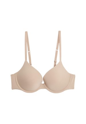 Soutien-gorge rembourré beige avec bretelles réglables, texture lisse, bonnets ronds et fermeture à crochet. Design minimaliste sans motifs ni ornements visibles.