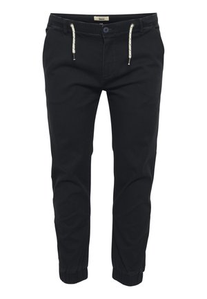 Pantaloni de jogging negri cu manșete elastice, talie cu șnur și o singură închidere cu buton. Realizați dintr-un material moale și ușor.