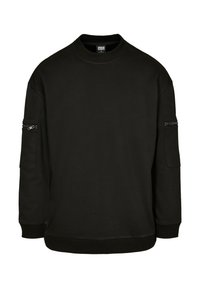 Melns džemperis ar apaļu kakla izgriezumu un garām piedurknēm. Piedurkņu kabatās rāvējslēdzēji un ribstoti aproces un apakšmala.