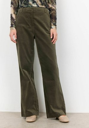 Olive green corduroy wide-leg pants with a smooth texture, featuring front pockets and a tailored waist. Worn with beige studded shoes.