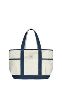 Canvas tote bag in crème met marineblauwe handvatten en accenten. Voorzien van een vierkante label met "BARTS" en twee externe zijvakken.