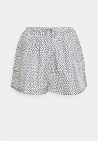 Szorty z elastycznym pasem i sznurkiem do ściągania. Wykonane z lekkiego materiału, z białą bazą i małymi granatowymi motywami kwiatowymi.