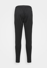 Black tapered athletic pants made of smooth fabric, featuring an elastic waistband and no visible pockets or hardware. Simple design.