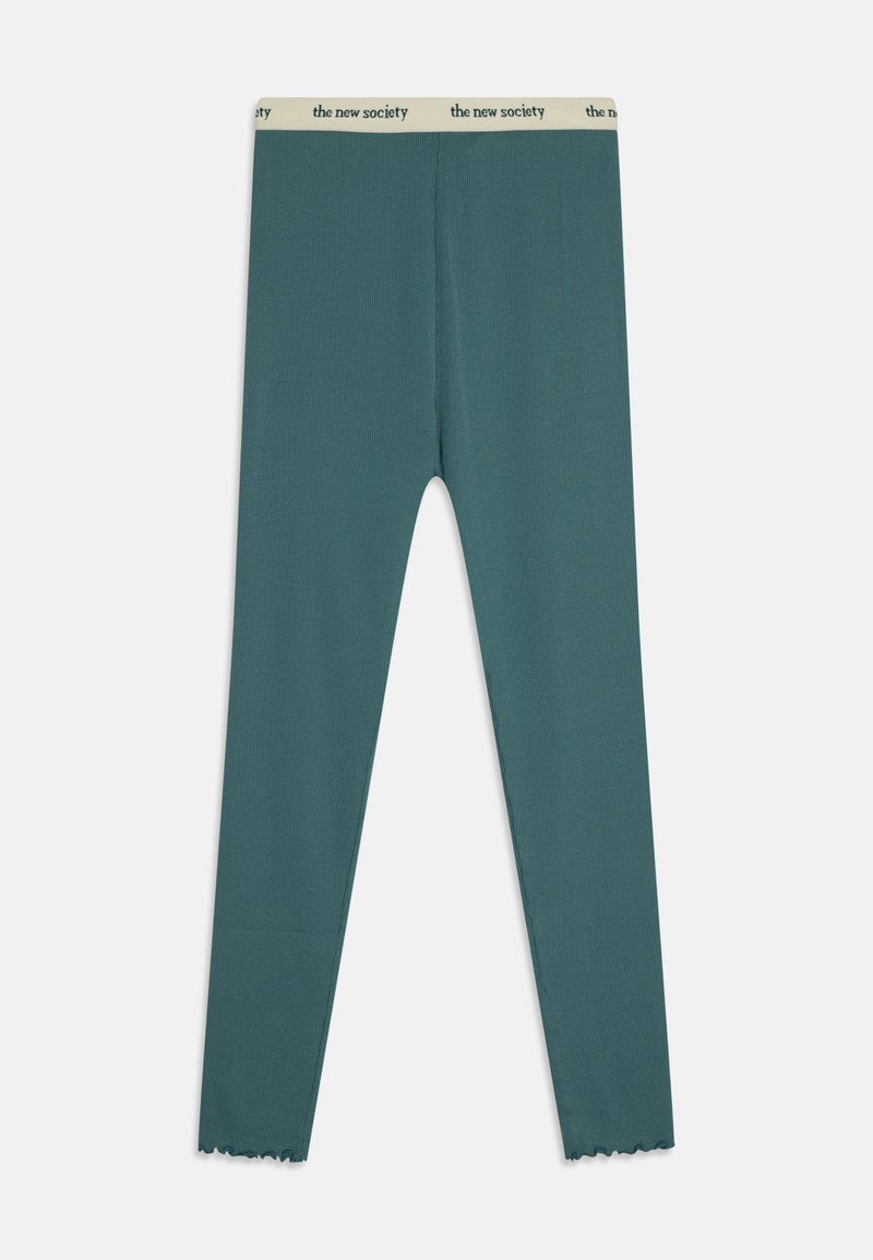 Τιρκουάζ κολάν κατασκευασμένα από ριμπ ύφασμα με κρεμ ελαστική ζώνη που φέρει το λογότυπο "the new society". Λεπτομέρεια με κωνικό τελείωμα στους αστραγάλους.