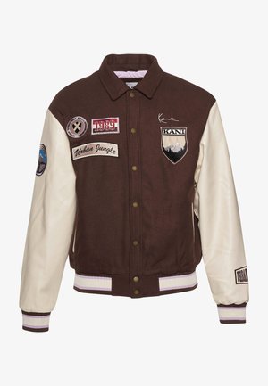 Braune und cremefarbene College-Jacke mit Knöpfen, gerippten Bündchen mit Streifen, verschiedenen Aufnähern und einem gestickten Berg-Logo.