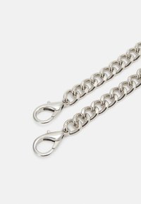 Silver metal chain with large links, featuring two lobster clasps at each end. Shiny surface, uniform design, and smooth texture.