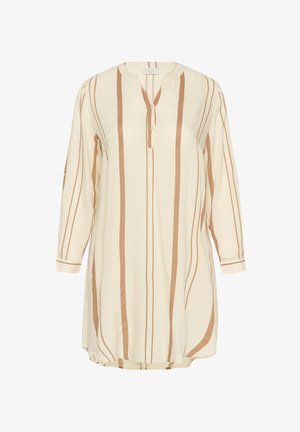 Tunika leggera crema con strisce marroni verticali, maniche lunghe, scollatura a V e bottoni davanti. Tessuto morbido con una vestibilità rilassata.