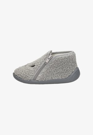Gray slipper with a soft, textured exterior, zip closure, and a flexible rubber sole. Low-ankle design with a rounded toe and minimal detailing.
