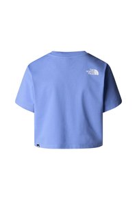 T-shirt cropped di colore azzurro chiaro realizzata in cotone, con maniche corte e un logo bianco sul retro vicino al collo. Design semplice.