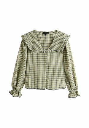 Pitkähihainen keltavihreä ruudullinen paita, jossa on röyhelöillä koristeltu neliskulmainen kaulus, nappikiinnitys edessä ja röyhelöidyt hihansuut mustalla reunuksella.