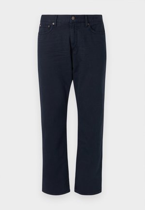 Pantalones de ganga azul marinho com corte reto, cinco bolsos e um pequeno logotipo na parte de trás. Textura suave e design clássico.