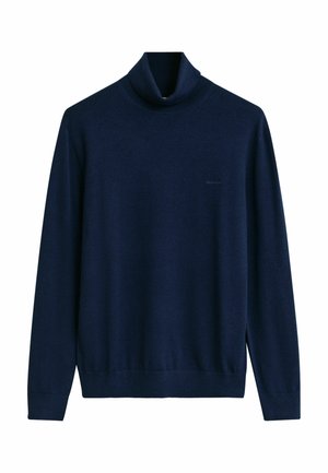 Marinblå höghalsshalsad tröja i mjukt tyg, med långa ärmar, figursydd silhuett och ribbade muddar och nederkant. Diskret logotypdetalj.