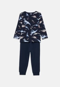 Maglia a maniche lunghe blu navy con stampa di dinosauri e pantaloni abbinati blu navy. La maglia presenta grafiche di dinosauri colorati di vari colori. Tessuto morbido, polsini elasticizzati.