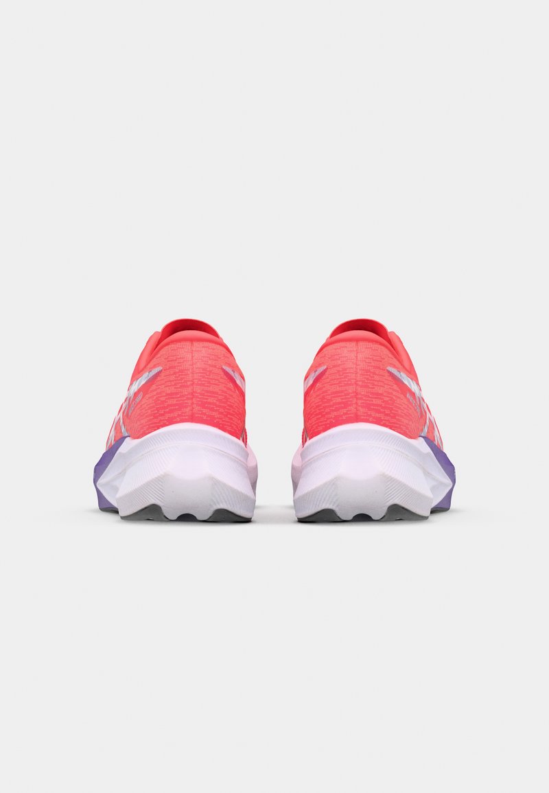 Lightweight running shoes featuring a bright pink knit upper, reflective accents, and a white and purple cushioned sole.