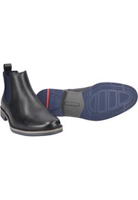Schwarze Leder-Chelsea-Stiefel mit einem blauen elastischen Seiteneinsatz, runder Zehenform und einer kontrastierenden blauen Gummisohle mit roten Akzenten.