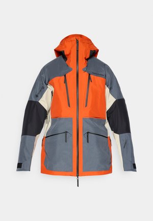 Huvjacka med paneler i orange, grått och svart. Vattentätt material med två fickor med dragkedja och svarta detaljer på ärmarna.