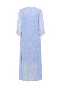 Light blue, long-sleeved maxi dress with a floral pattern. Soft, sheer fabric with a flowing silhouette and a scoop back design.