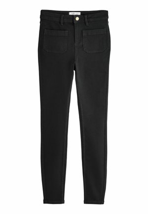 Black skinny jeans made of denim, featuring a classic five-pocket style, gold button, and stitched accents along the seams.