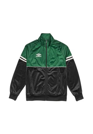 Trackjakke med en grøn øverste sektion, sort nederste del og hvide striber på skuldrene. Lavet af skinnende, glat stof med lynlås.