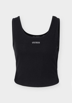 Svart ribbestrikket ermeløs croptopp med rund hals og hvit "GUESS"-logo midt på brystet.