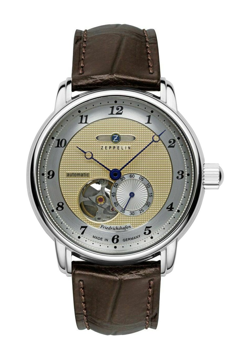 Zeppelin Automatikuhr mit einem silbernen und goldenen strukturierten Zifferblatt, braunem Lederarmband, Skelettfunktion bei 6 Uhr und blauen Akzenten auf den Zeigern.