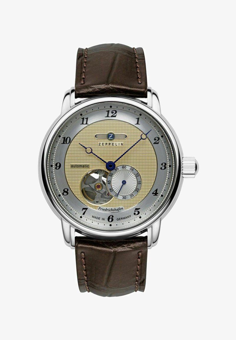 Zeppelin Automatikuhr mit einem silbernen und goldenen strukturierten Zifferblatt, braunem Lederarmband, Skelettfunktion bei 6 Uhr und blauen Akzenten auf den Zeigern.