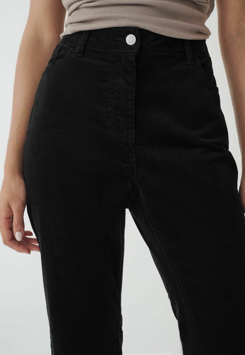 Next HOURGLASS FLARED - Housut - black