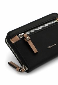 Black fabric wallet with a smooth exterior, featuring silver zipper hardware and tan leather accents. Compact design with a zippered pocket.