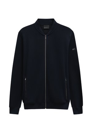 Marineblaue Zip-Jacke mit strukturierter Optik, geripptem Kragen und Bündchen. Verfügt über zwei Seitentaschen und ein kleines Logo am oberen Arm.