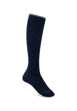 Chaussette bleu foncé montante jusqu'au genou avec de petits points bleu clair et une bande gris clair en haut, présentée sur un fond blanc.