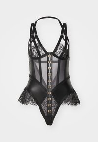 Body nero con dettagli in pizzo, pannelli trasparenti e design strutturato. Presenta hardware in tonalità oro e una finitura in pizzo arricciato sull'orlo.