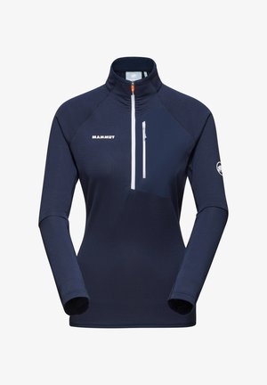 Maglietta a maniche lunghe mezza zip blu navy con tessuto testurizzato, logo bianco e una piccola tasca con zip sul petto. Il colletto si alza al collo.